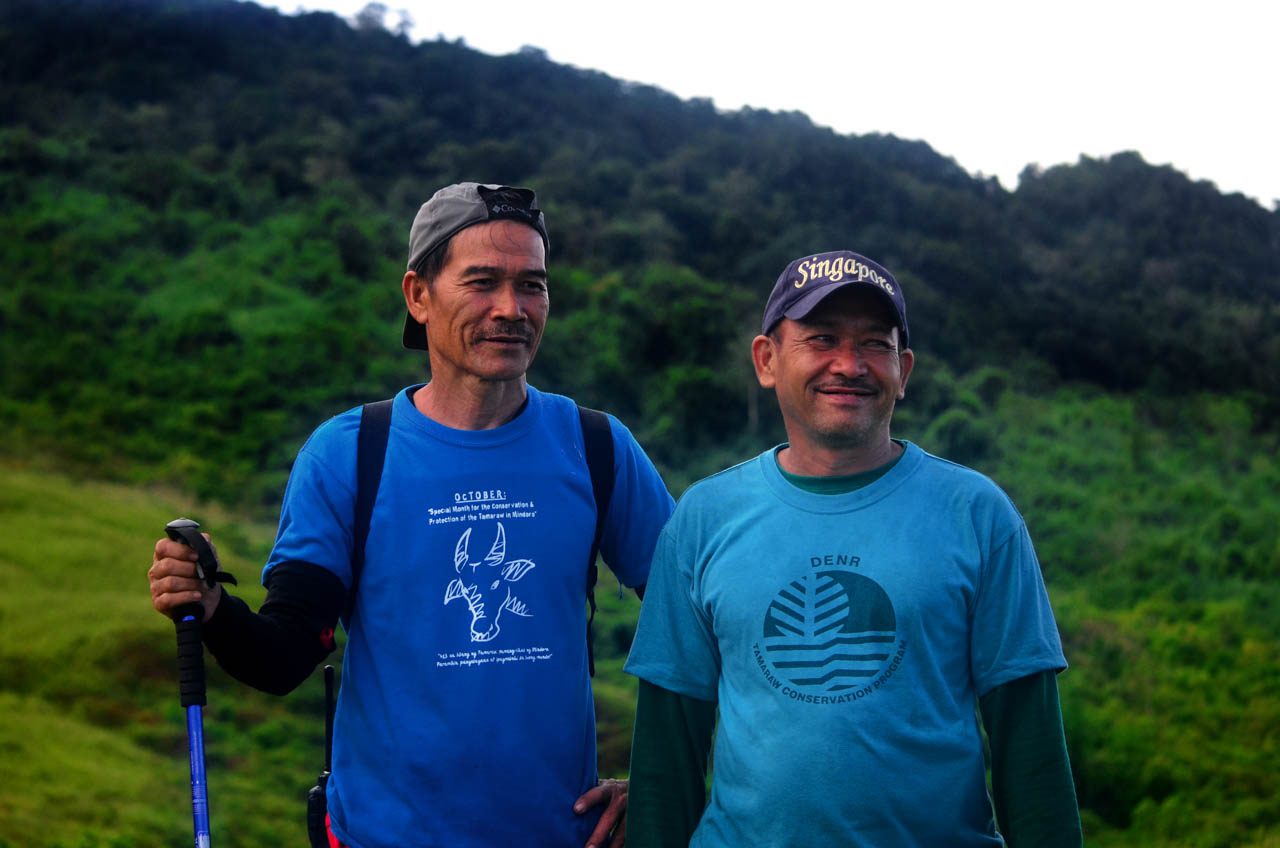 RANGERS. Tamaraw Conservation Program rangers Ed Bata and Ronnie Estrella inside the Iglit-Baco Natural Park. Underfunded and lacking tenure, they nonetheless comprise some of the bravest and most dedicated conservation outdoorsmen in the Philippines. Photo by Gregg Yan/BIOFIN
 
