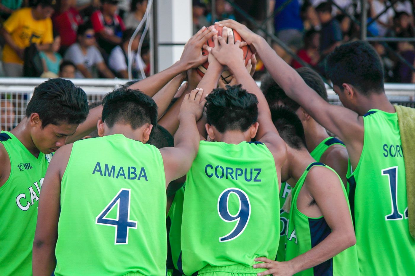 STRENGTHENED BY FAITH. Players of CAVRAA's Secondary Basketball team offer a silent prayer after losing their third game to DAVRAA on Wednesday, April 26.  