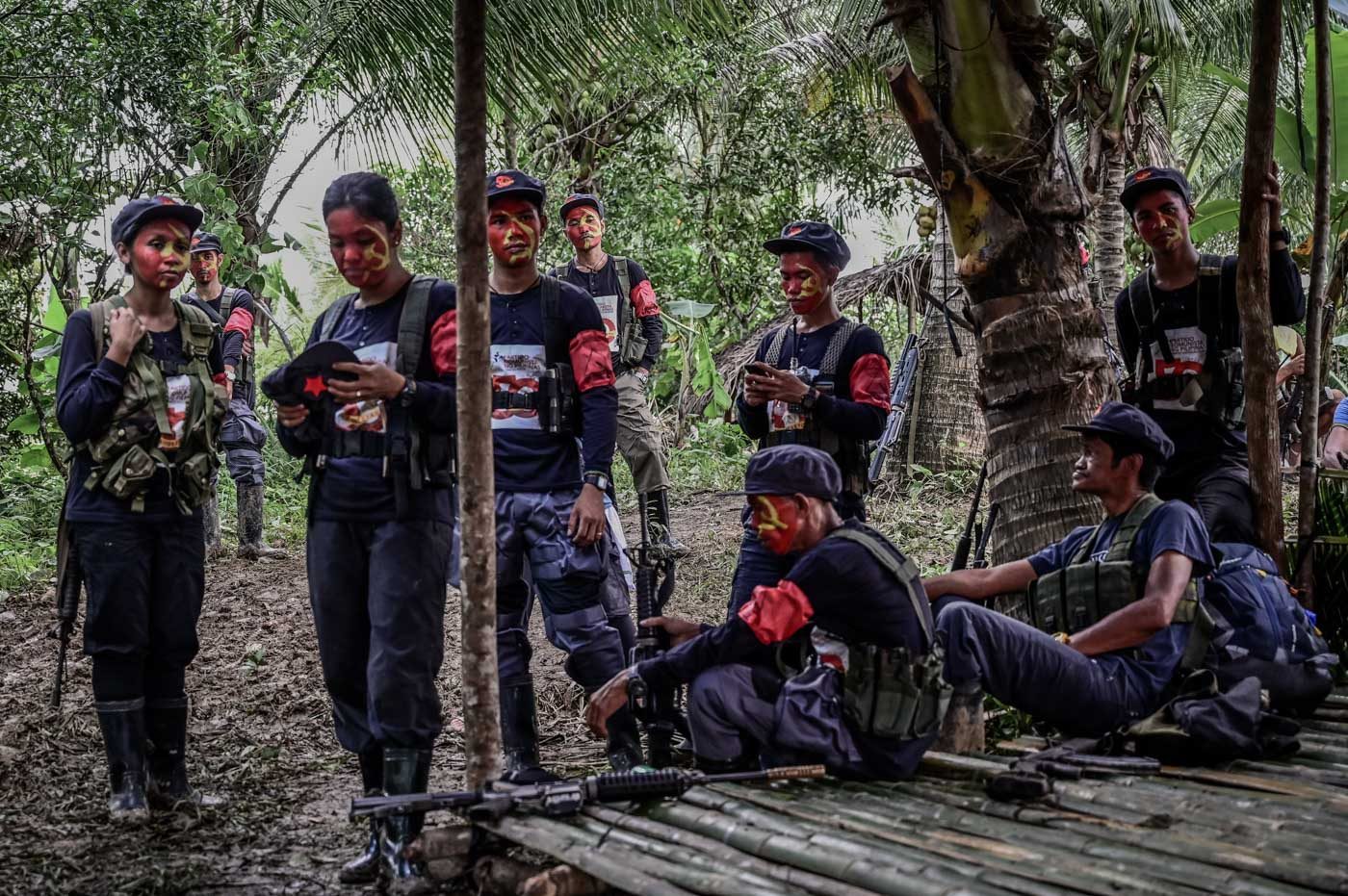 WAITING. NPA fighters rest before the start of the celebration. 