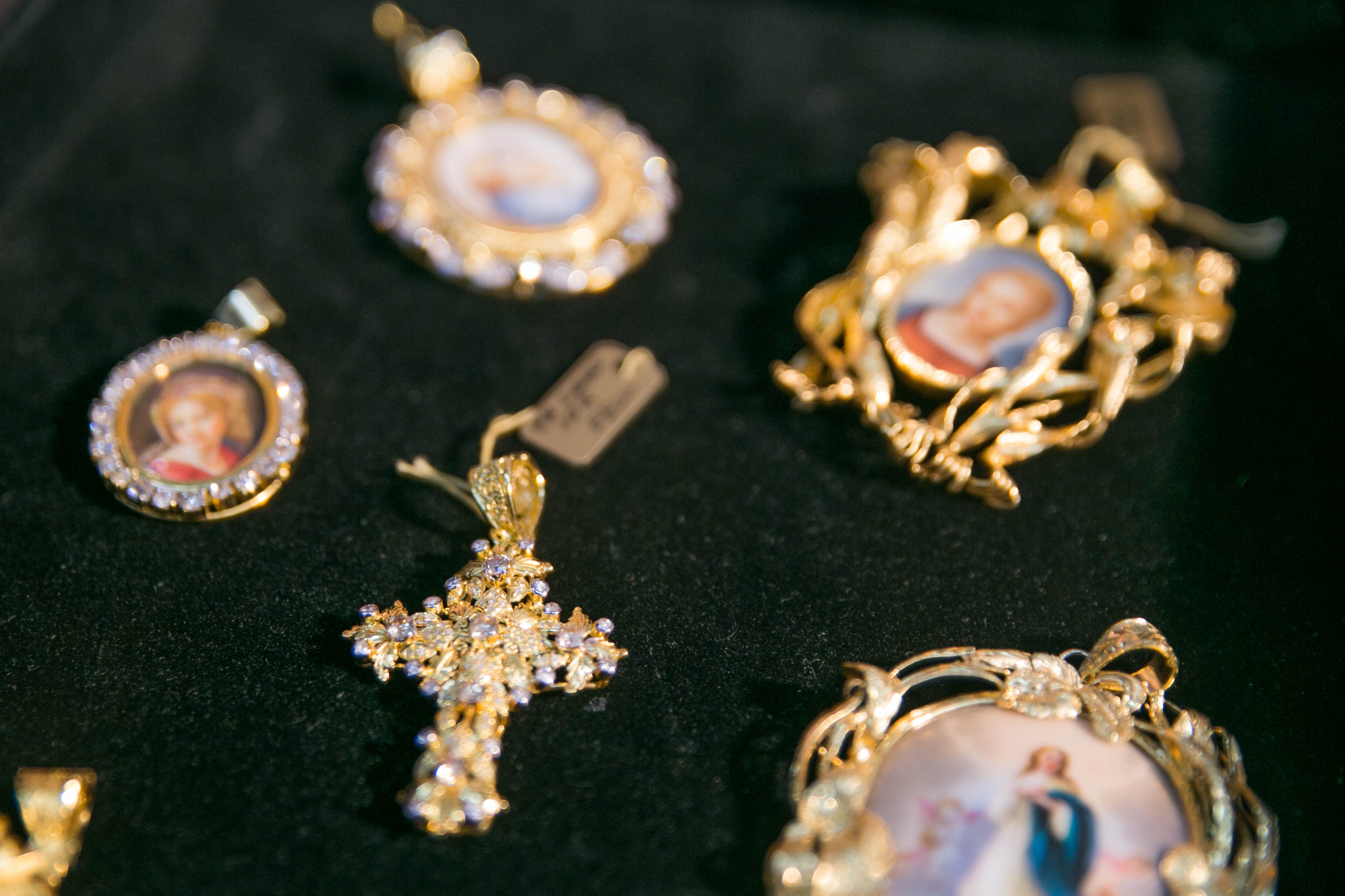 ANTIQUE. Maria Angelica sells religious pendants that date back to the Spanish occupation in the Philippines. Photo by Pat Nabong/Rappler