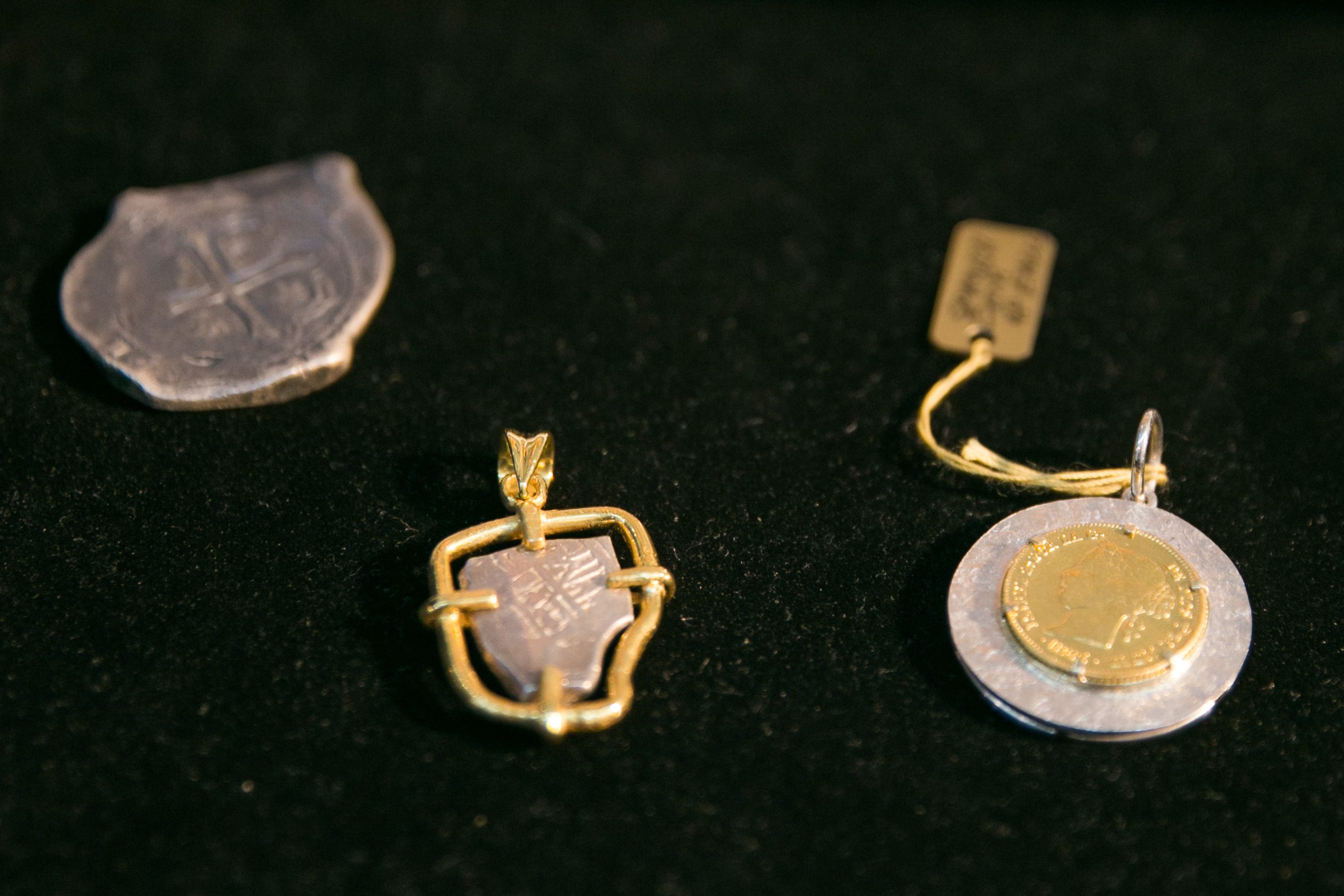 ANTIQUE COINS. Hilis Kalamays (left) are coins used during the Galleon Trade. In the center is a hilis kalamay that Maria Angelica turned into a pendant. Photo by Pat Nabong/Rappler