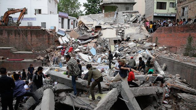 RESCUE. People search for survivors stuck under the rubble of a destroyed building, after an earthquake caused serious damage in Kathmandu, Nepal, April 25, 2015. Narendra Shrestha/EPA 
