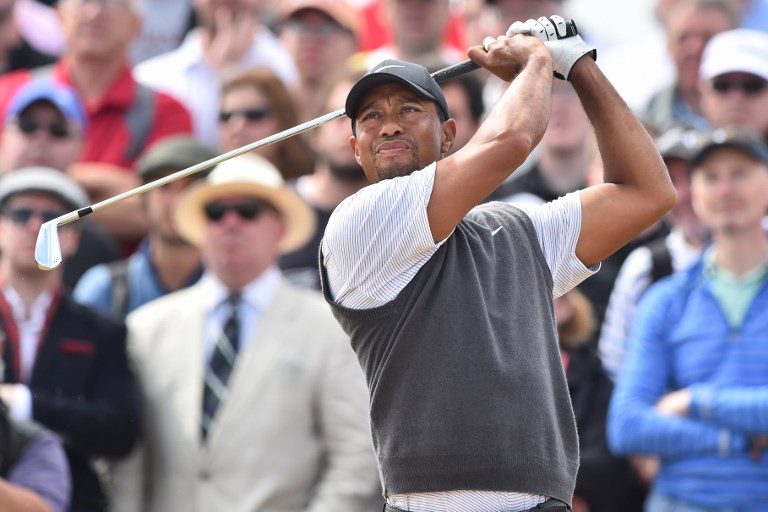Tiger Woods moves into share of lead at British Open