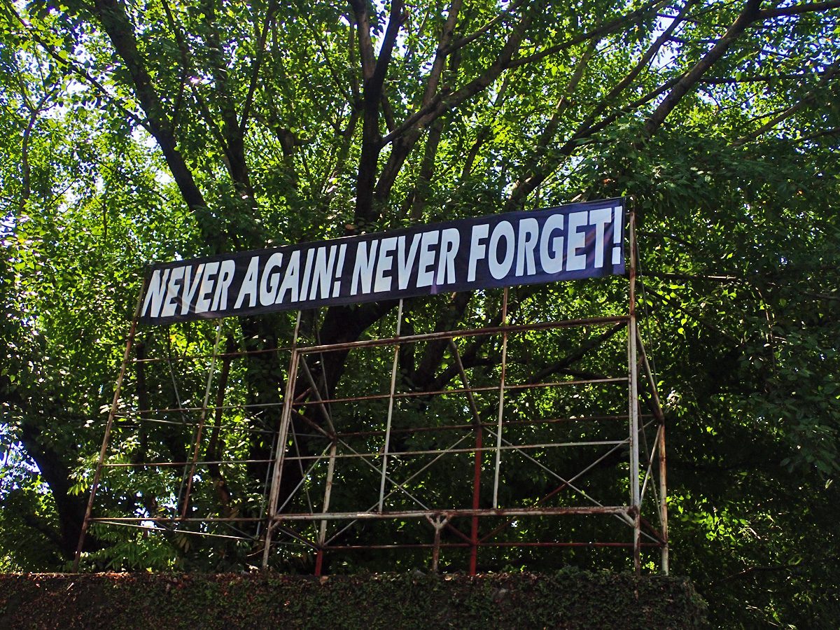 PROTEST. These words are visible among the trees as you walk deeper into Bantayog's compound.   