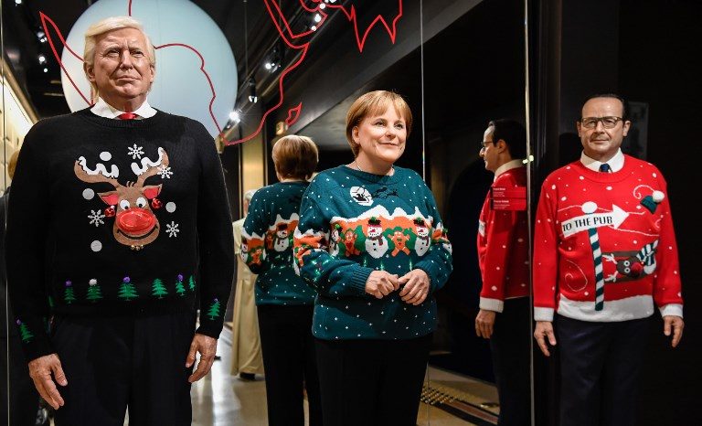 'TIS THE SEASON. The wax figures of US President Donald Trump, German Chancellor Angela Merkel, and former French President Francois Hollande are featured in Christmas-themed sweaters at the Grevin Wax Museum on December 1, 2017, in Paris. Photo by Bertrand Guay/AFP   