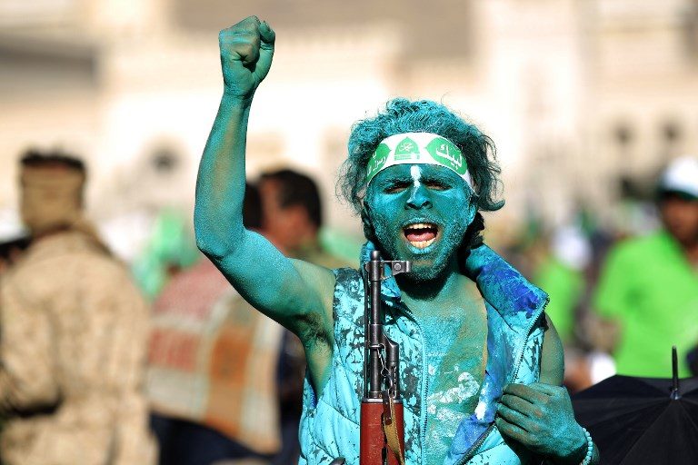 RELIGIOUS RALLY. A Muslim Yemeni, covered with green paint, chants slogans as he attends a rally in the capital Sanaa on the occasion of the Prophet Mohammed's birthday on November 30, 2017. Photo by Mohammed Huwais/AFP  