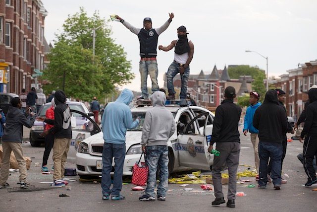 Baltimore deploys Guard troops as riots erupt