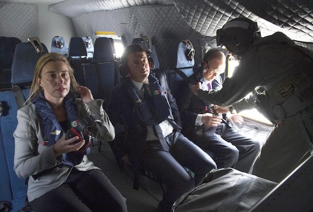 ALL ABOARD. A handout photograph made available by the Palazzo Chigi press office showing Italian Prime Minister Matteo Renzi (C), the UN Secretary General Ban Ki-moon (R), and EU High Representative for Foreign Affairs and Security Policy Federica Mogherini (L), on board a helicopter heading to the Italian Navy ship San Giusto, in the Strait of Sicily, Italy, April 27, 2015. Toberio Barchielli/Press Office Palazzo Chigi/Handout/EPA 