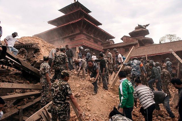 REDUCED TO RUBBLE. A handout photo provided by the International Federation of the Red†Cross (IFRC) on April 26, 2015 of rescue workers sifting the ruins of a building for possible survivors in Kathmandu, Nepal, April 25, 2015. Carl Whetham/IFRC/Handout/EPA 