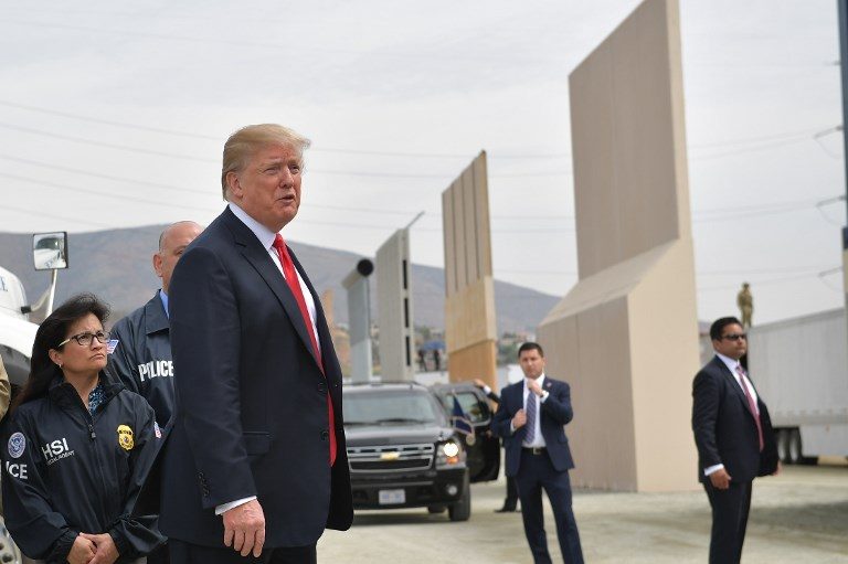 BORDER INSPECTION. US President Donald Trump inspects border wall prototypes in San Diego, California, on March 13, 2018. Photo by Manuel Ngan/AFP  
