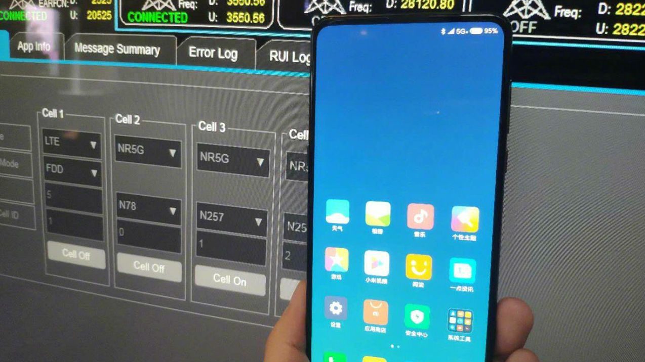 Executive shows Xiaomi phone with 5G signal