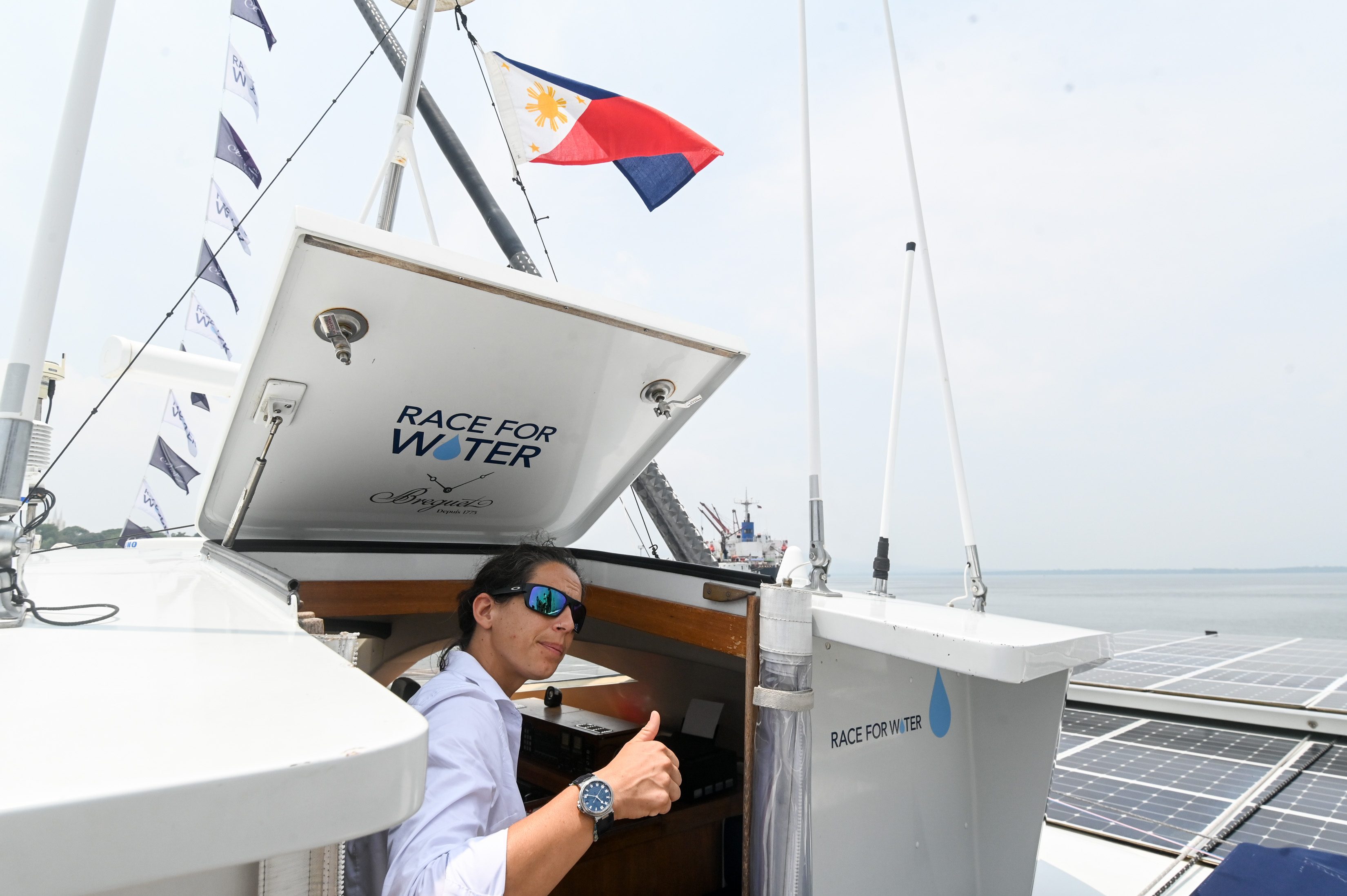 FAIR WEATHER. A Philippine flags hangs outside the ship. Photo by Alecs Ongcal/Rappler   