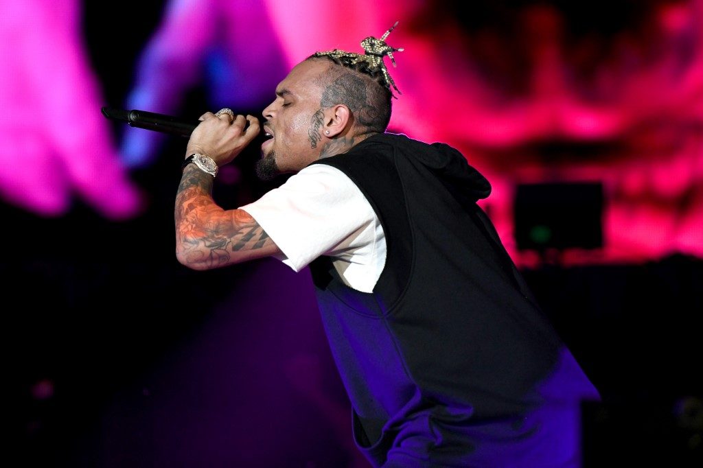 Chris Brown skips Paris hearing over rape accusation