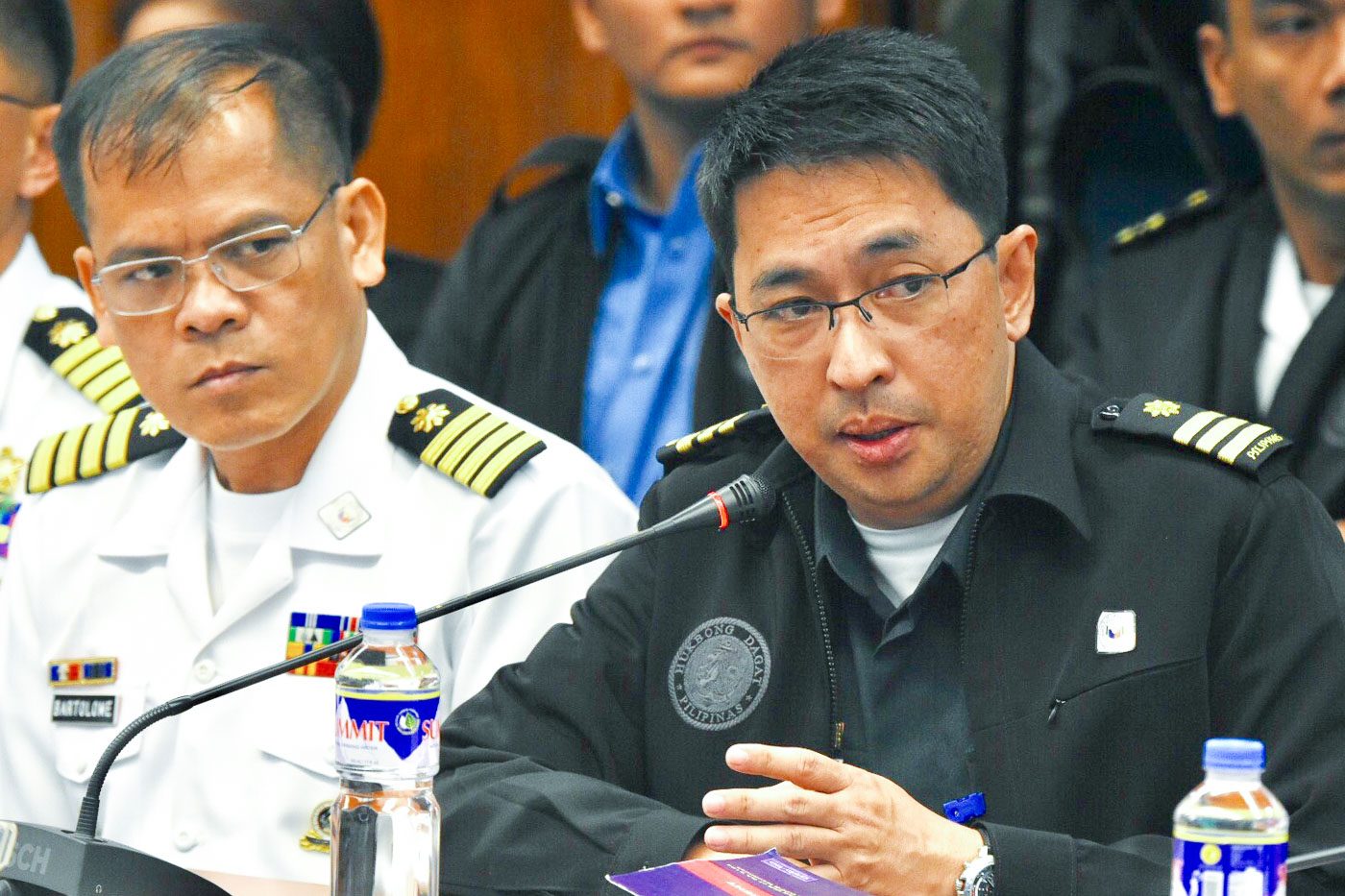 ORIGINAL SIN? Commodore Sergio Bartolome and Major Marlon Dayao discuss how a provision supposedly disadvantageous to the Philippine Navy was inserted in the contract. Photo by Angie de Silva/Rappler  
