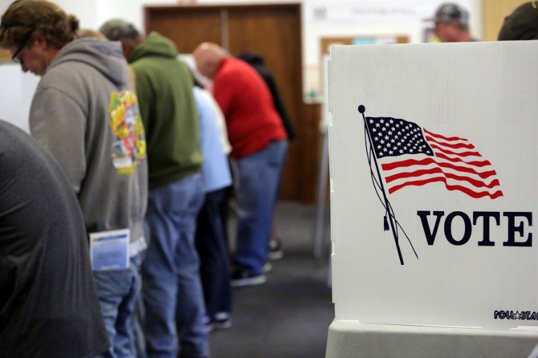Voters cast ballots at a polling station at the Big Bear Lake Methodist Church in Big Bear, California, November 8, 2016. Bill Wechter/AFP 