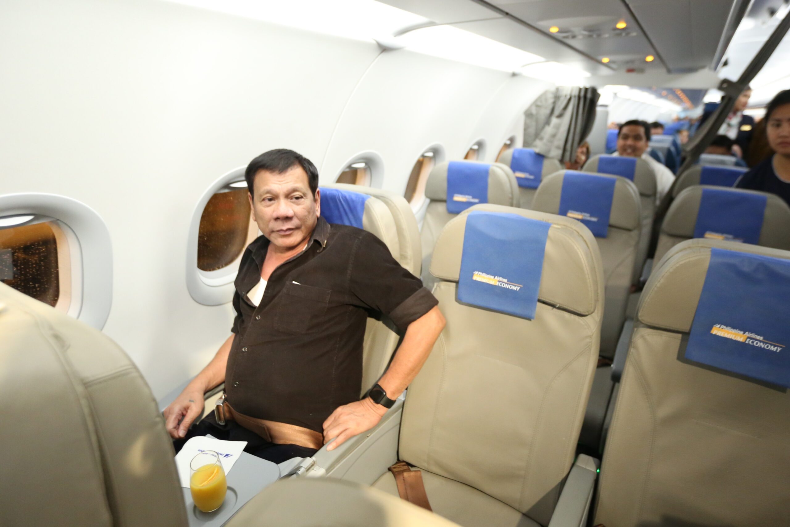 IN PHOTOS: Duterte takes commercial flight to Davao