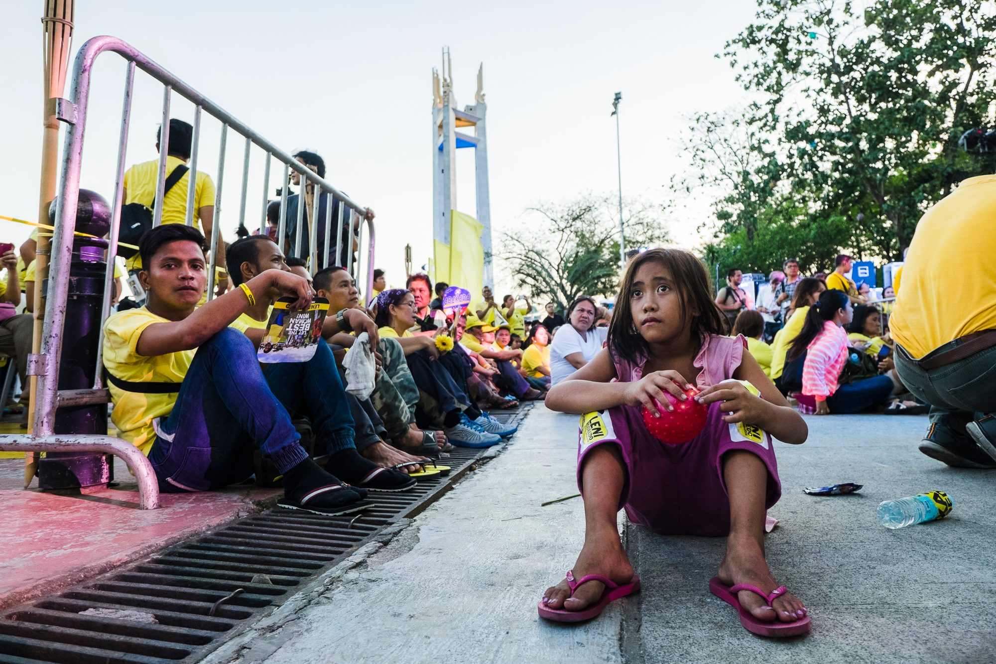 THE FUTURE. A street child sits with Robredo's supporters during her send-off at QC Circle. 