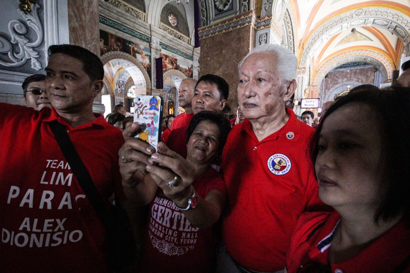 COMEBACK BID. A supporter takes a selfie with former Manila mayor Alfredo Lim inside the Sto Nino Church. Photo by Lito Borras/Rappler  