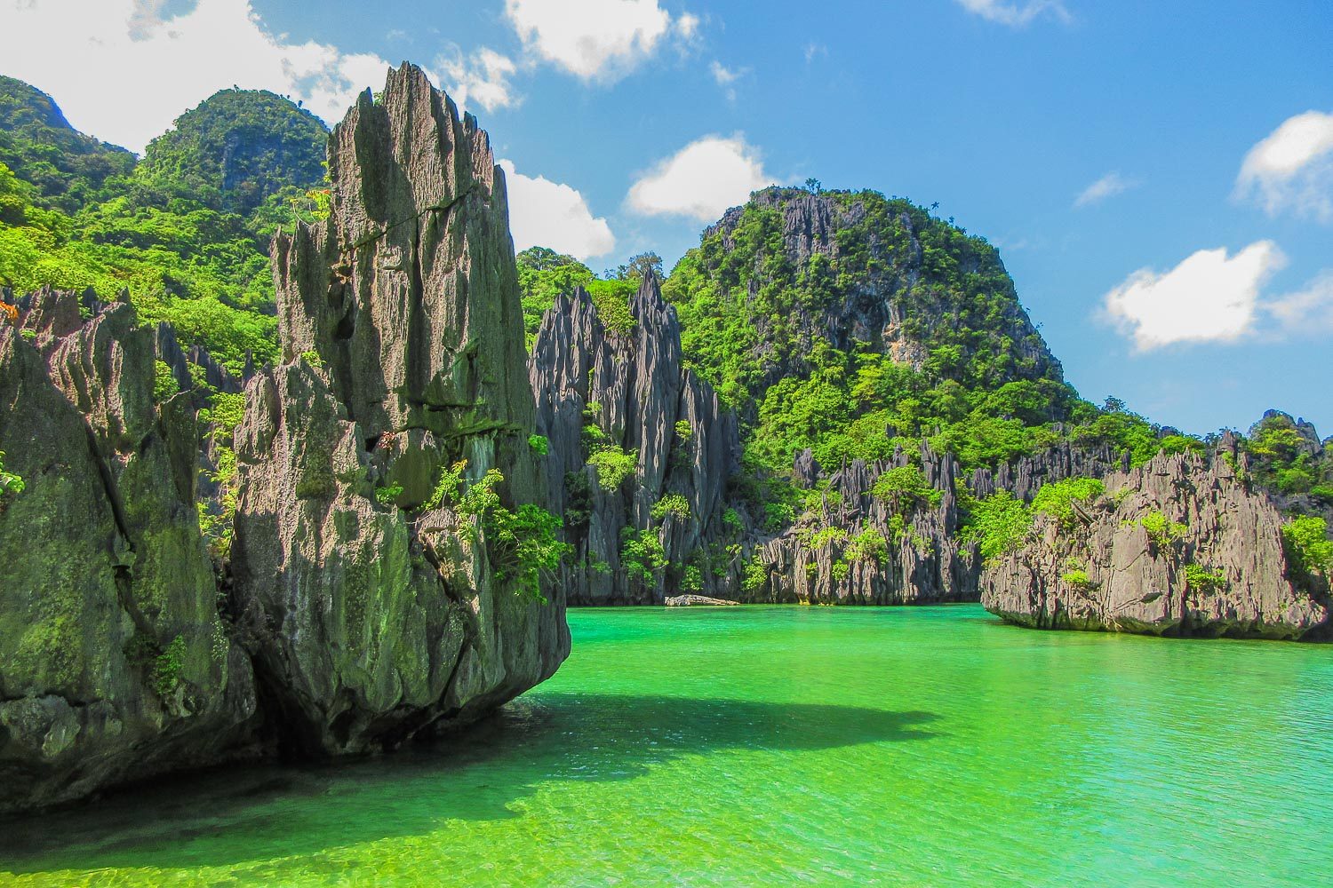 LAGOON. Cadlao Lagoon has emerald waters and towering limestone formations surrounding it. 