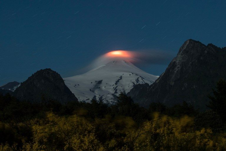 IMMINENT DANGER. View of the Villarrica volcano taken from Pucon, some 800 kilometers south of Santiago, Chile, showing signs of activity on December 6, 2017. Photo by Christian Miranda/AFP   