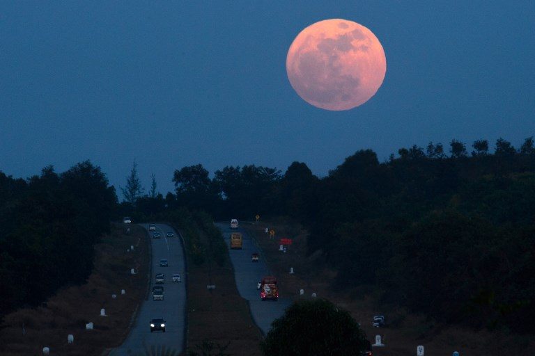 CLOSEST POINT TO EARTH. The supermoon rises over a highway near Yangon on December 3, 2017. Photo by Ye Aung Thu/AFP  