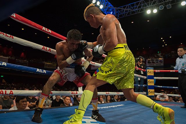 Albert Pagara connects with a right hand on Yesner Talavera. Photo by Arvee Eco/Rappler 