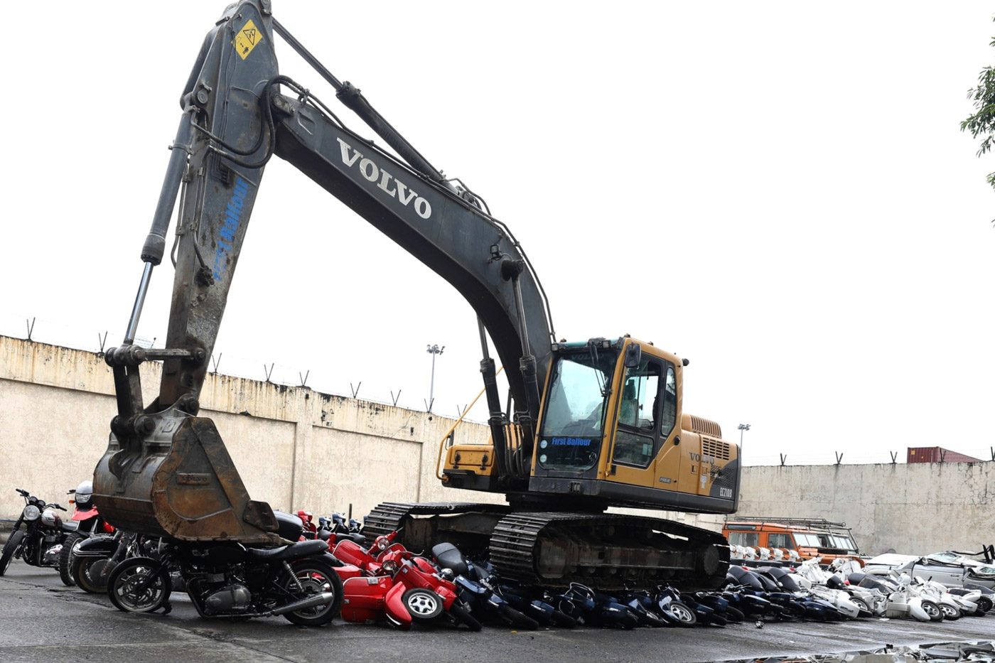CRUSHED. The Bureau of Customs destroys smuggled luxury motorcycles and vehicles at the Port Area in Manila on May 30, 2018. Malacañang photo  