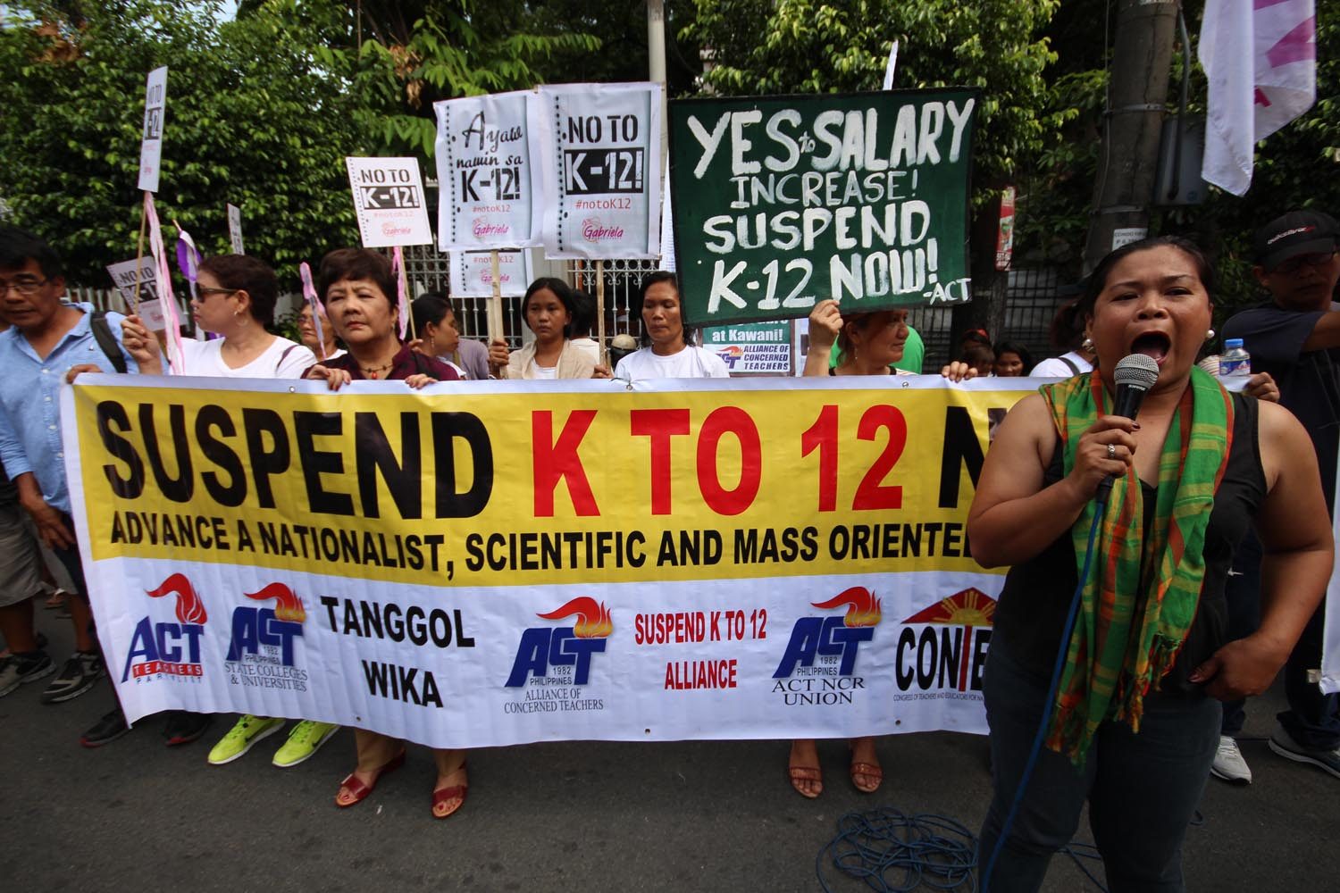 SUSPEND? Days prior to the school opening on June 1, 2015, concerned parents, along with their kids, stage a protest action in front of the Supreme Court on Friday to ask the SC to stop the K to 12 program. File photo by Joel Leporada/Rappler 