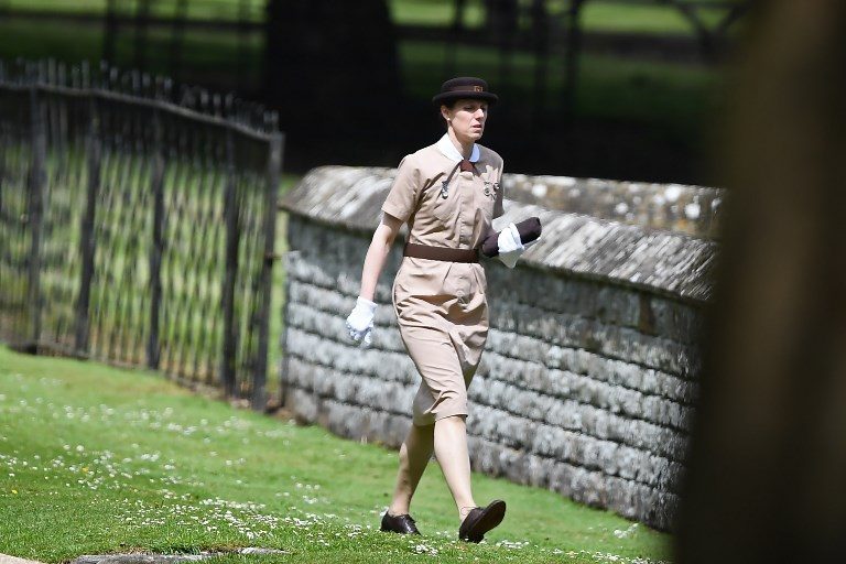Nanny to Prince George and Princess Charlotte of Cambridge, Maria Borrallo, walks to the church ahead of the wedding of Pippa Middleton and James Matthews at St Mark's Church in Englefield, west of London, on May 20, 2017. Photo by Justin Tallis/AFP Photo 