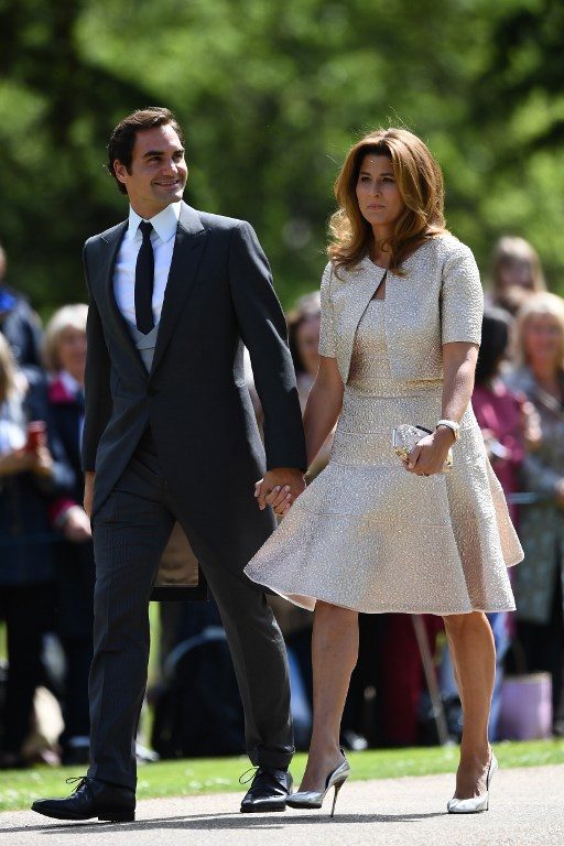 Swiss tennis player Roger Federer (L) and his wife Mirka attend the wedding of Pippa Middleton and James Matthews at St Mark's Church in Englefield, west of London, on May 20, 2017. Photo by Justin Tallis/AFP Photo 