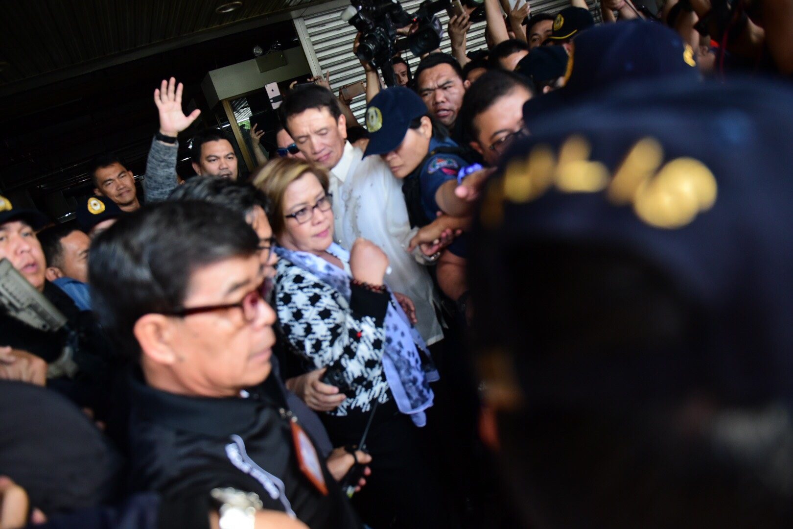 LONG DAY. Senator Leila de Lima is accompanied by her lawyer Alexander Padilla to a waiting PNP team.  