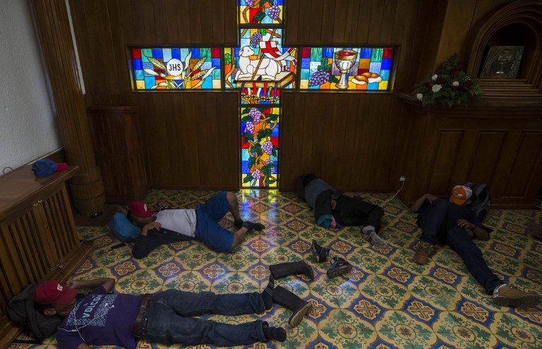 SAFE HAVEN. Peasants spend the night at the Metropolitan Cathedral in Managua, where they took refuge during deadly clashes after a march marking Nicaragua's National Mother's Day on May 31, 2018. Photo by Inti Ocon/AFP  