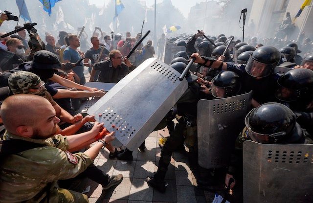 Ukraine on edge after clashes as third policeman dies