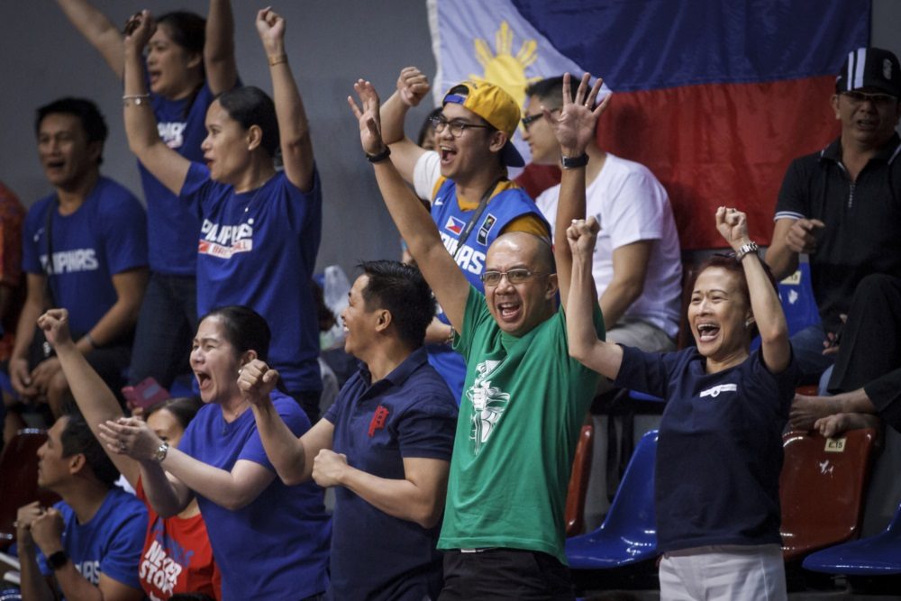 HAPPY FANS. Filipinos in Indonesia cheer on Batang Gilas. Photo from FIBA 