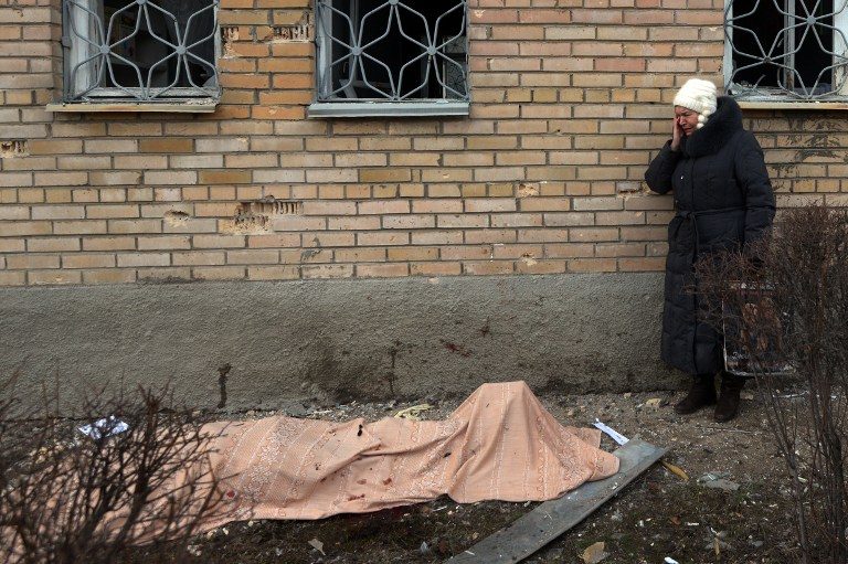 AGONY. A woman cries near the body of her son, killed during a shelling at the hospital of Donetsk's Tekstilshik district, on Febuary 4, 2015. 