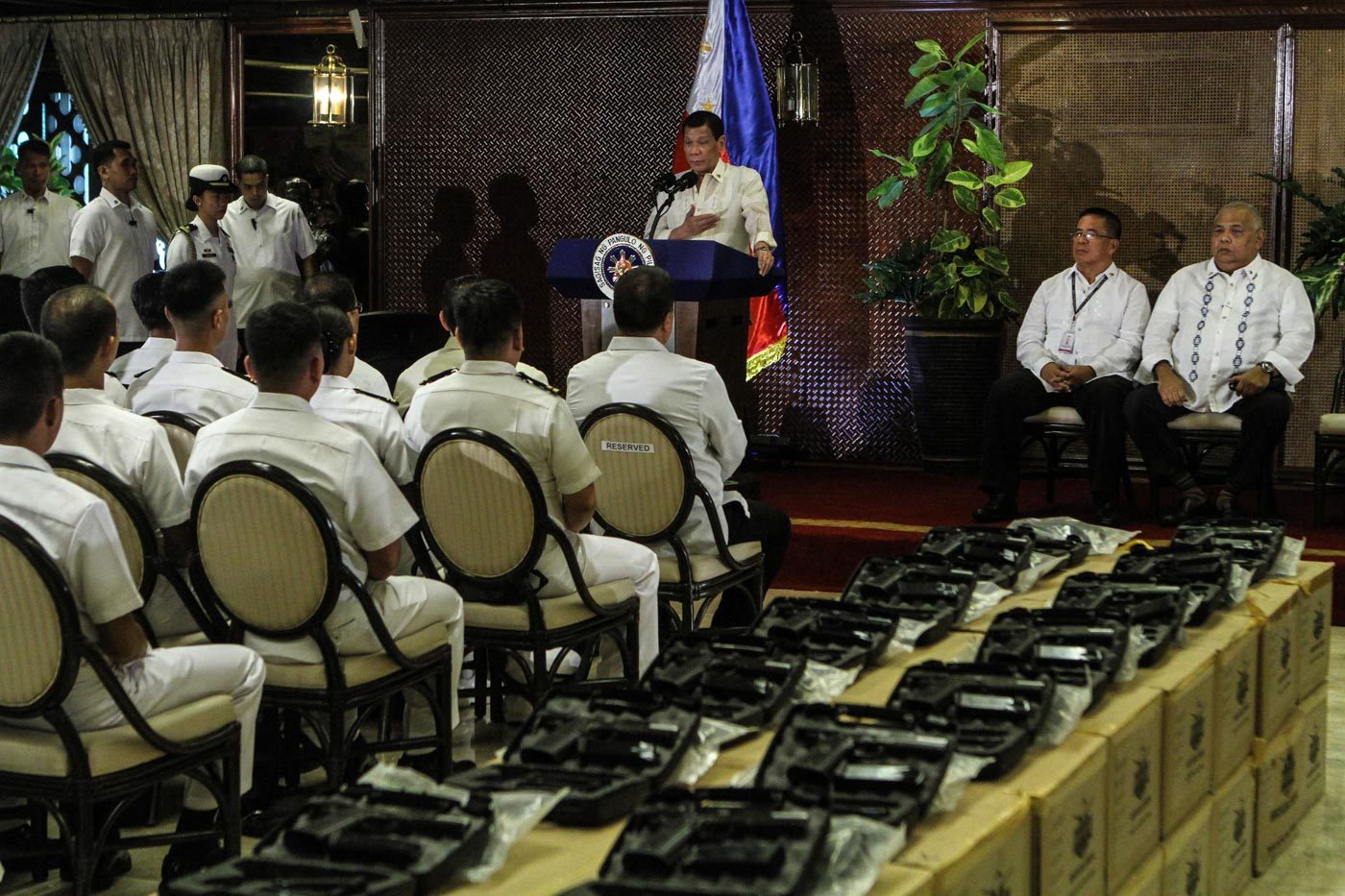 ADDED PROTECTION. The new caliber .45 pistols are on display as President Rodrigo Duterte gives his speech. Photo by Lito Boras/Rappler 