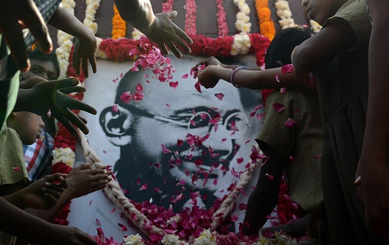 MARTYR'S DAY. Indian school children pay homage to a portrait of Indian independence icon Mahatma Gandhi, on Martyr's Day marking the 70th anniversary of Gandhi's assassination, in Chennai on January 30, 2018. Photo by Arun Sankar/AFP 