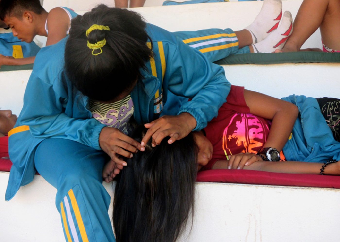 A GIRL THING. Coach and athlete shows sisterly bond while resting at the Binirayan Sports Complex.  