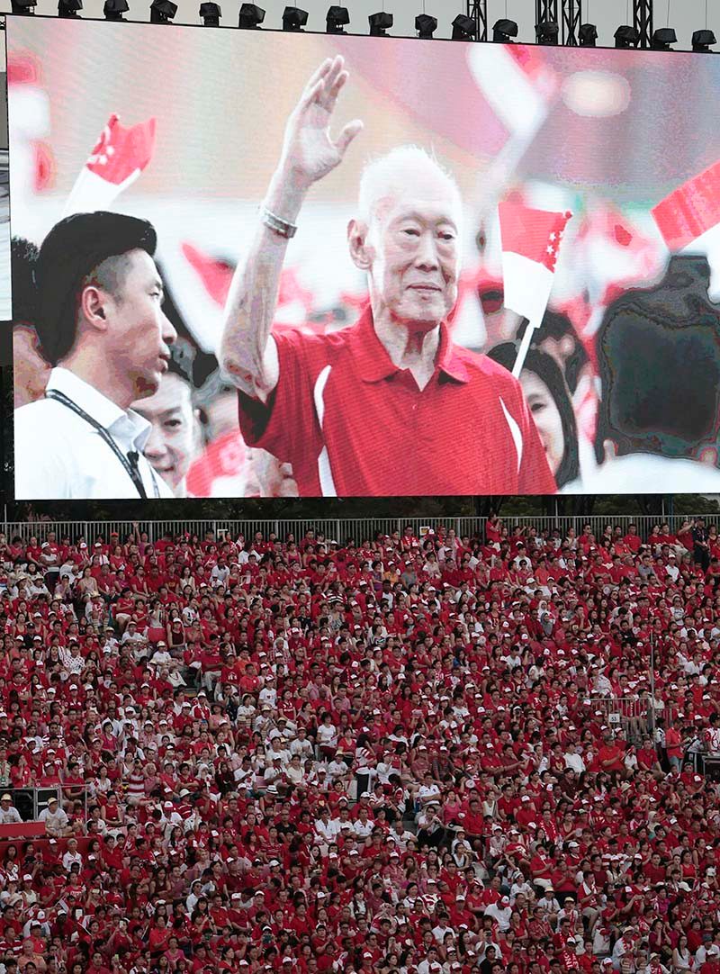 An image of the late Lee Kuan Yew, Singapore's first Prime Minister, is displayed on an electronic board above the crowd during the National Day Parade in Singapore. Photo by Wallace Woon/EPA  