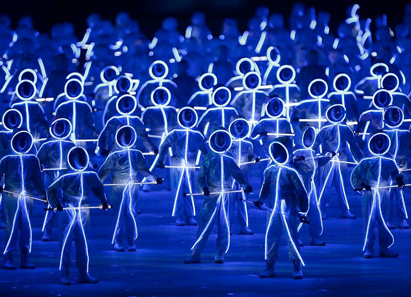 Performers wearing illuminated LED suits dance on the parade square during the National Day Parade in Singapore. Photo by Wallace Woon/EPA  
