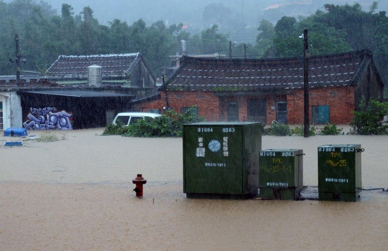 One dead, two missing as Taiwan battles floods