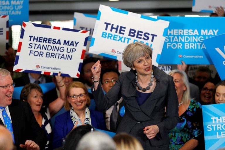 May woos Brexit voters but manifesto row hits support