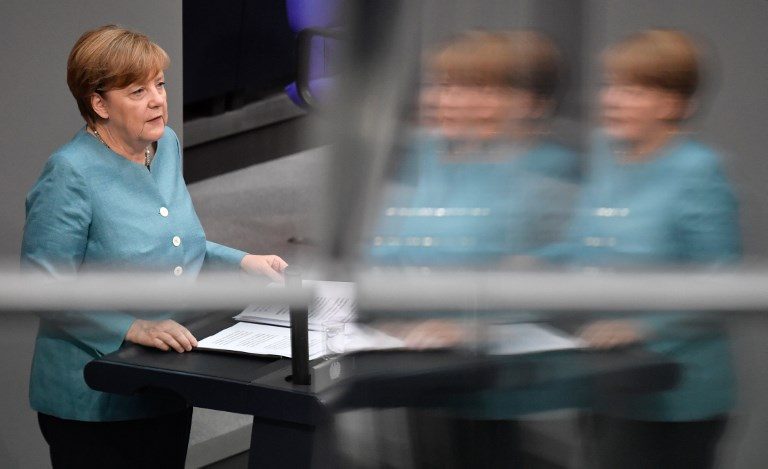 Merkel takes aim at Trump ahead of stormy G20