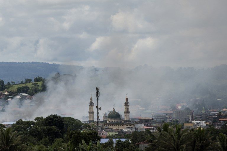 AIR STRIKE. Smoke rises after aerial bombings by Philippine Air Force planes on Islamist militant positions in Marawi on June 6, 2017. Photo by Noel Celis/AFP   