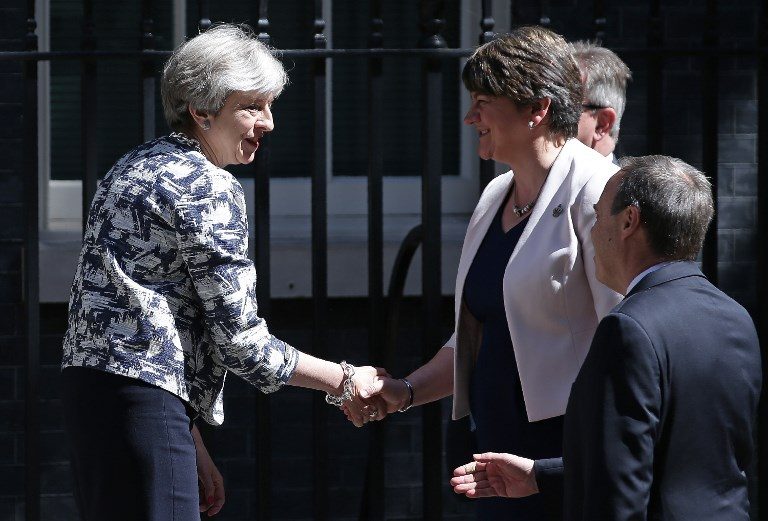 May strikes power deal with Northern Ireland’s DUP