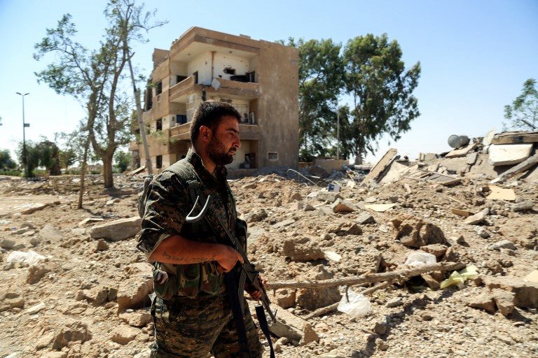 U.S.-backed forces cut off last ISIS escape route from Raqa