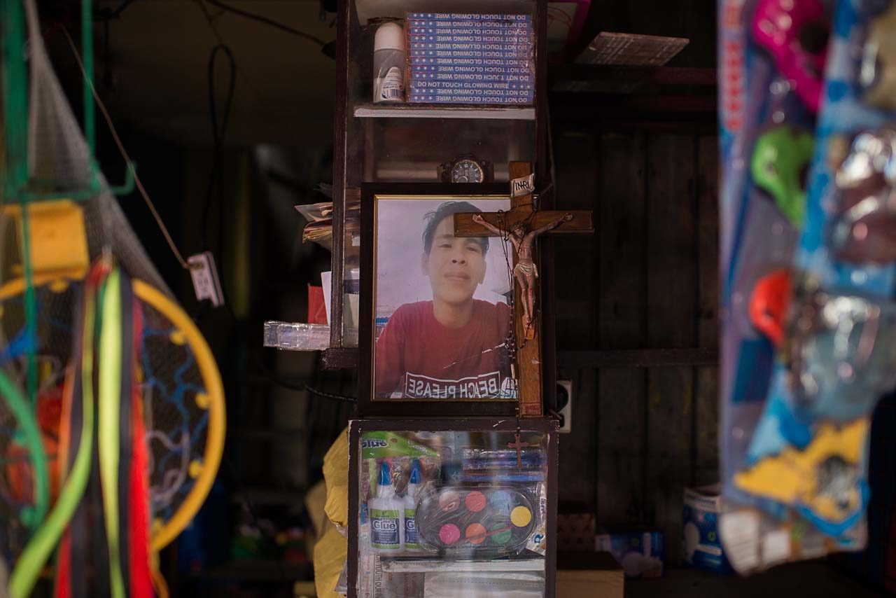 HEART OF THE STORE. Kian's photo hangs on a wall in the sari-sari store he used to tend 