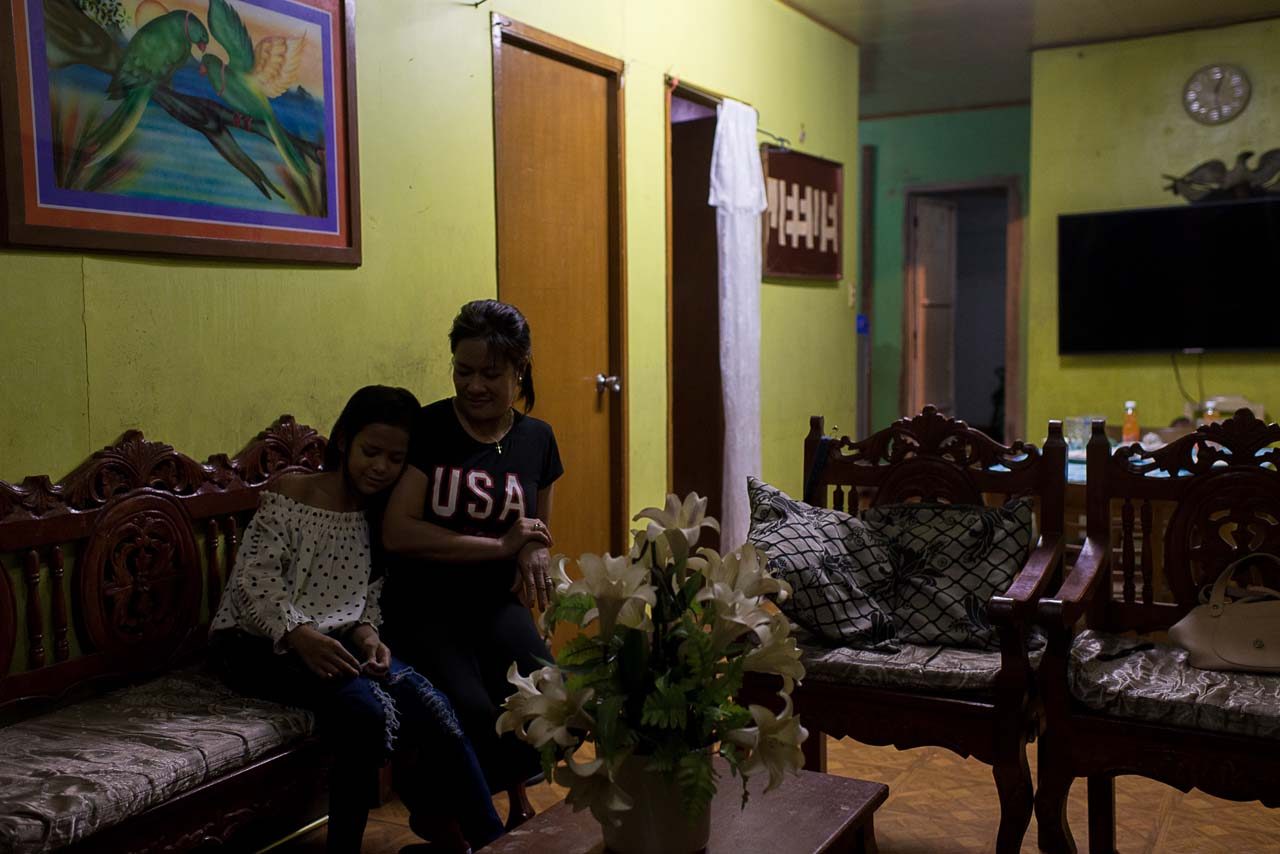 MISSING RAYMART. Luzviminda and Isabelle sit in the living room of their home in Cavite. All photos by Eloisa Lopez/Rappler 