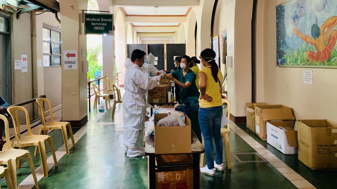 WEARING PPEs. Safety officers supervise assist PGH healthcare workers during donning and doffing. Photo courtesy of Philippine General Hospital 