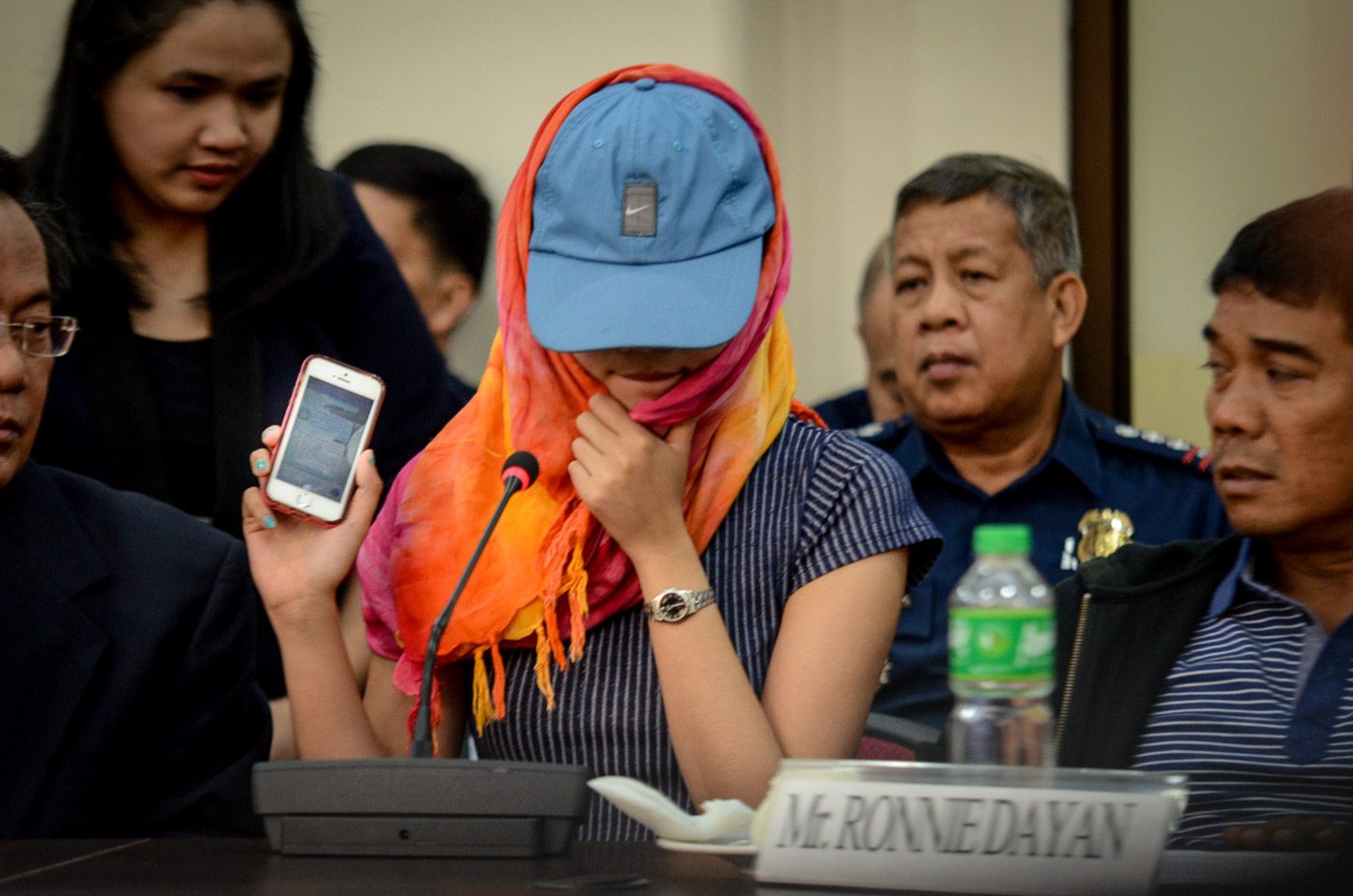 DAYAN'S DAUGHTER. Hannah Mae shows Congress investigators the text exchanges between her and Senator Leila de Lima. Photo by LeAnne Jazul/Rappler 